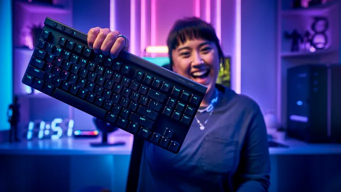 Image of someone holding the Logitech G515 up to the camera