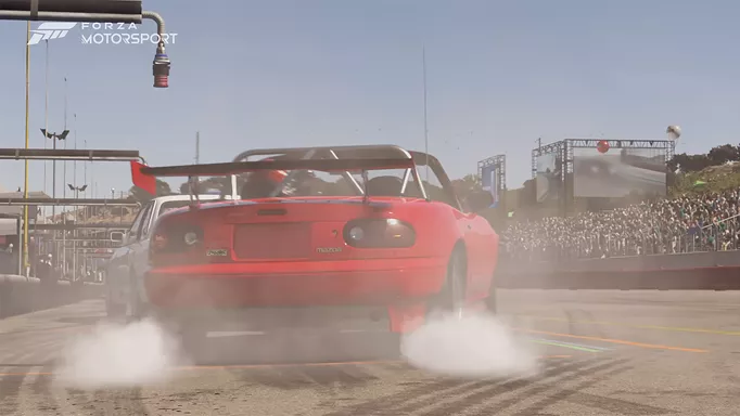 A red Mazda speeding on the track in Forza Motorsport