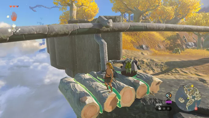 Link rides with the Korok on a makeshift rail platform in The Legend of Zelda: Tears of the Kingdom